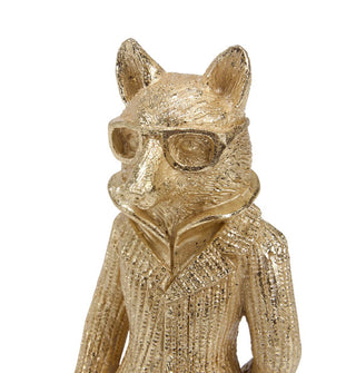 Closeup of a gold statue of a fox wearing glasses, a jacket, and high-collared shirt