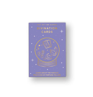 Periwinkle box of Divination Cards with central gold foil crystal ball illustration surrounded by small white stars