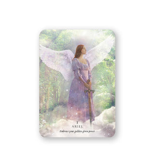 The Ariel card from the Divine Feminine Archangel Oracle deck features ethereal image of a gowned, winged angel holding a sword in a cloud-obscured forest and symbolizes embracing your goddess-given power 