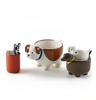 Four ceramic measuring cups designed to resemble different breeds of dogs