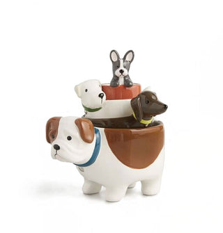 Ceramic dog nesting measuring cups stacked one inside the other