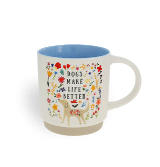 White coffee mug with beige stoneware bottom and blue interior features colorful floral designs, a cartoon-style dog portrait, and the words, "Dogs make life better"