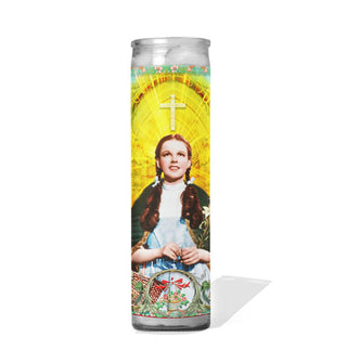 Tall glass prayer candle with colorful label depicting Judy Garland's Wizard of Oz Character Dorothy Gale as a saint