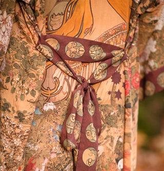 Robe with an art nouveau print and contrasting border and tied belt