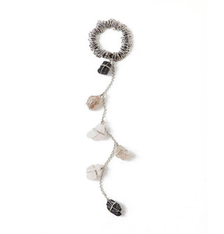 A silver chain fitted with five wire-wrapped rough-cut gemstones is attached to a silver wire-wrapped black elastic hair tie