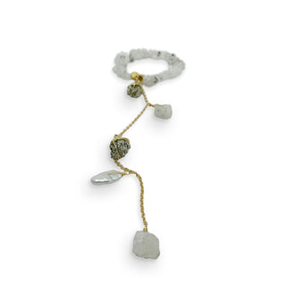 A brassy chain fitted with five wire-wrapped rough-cut gemstones and one pearl is attached to a circle of grayish-white stones