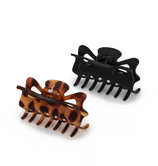 One matte black and one matte brown tortoise claw clip