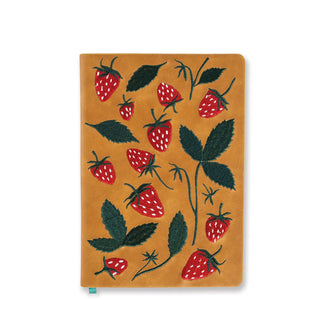 Brown journal cover features embroidered design of red strawberries with white seeds and green foliage