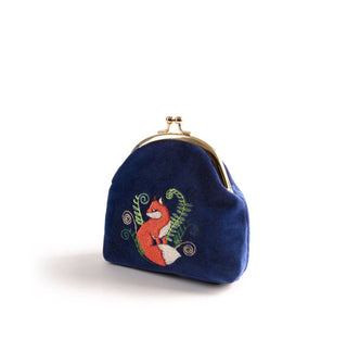 Dark blue velvet change purse with rounded gold kiss lock top frame features an embroidered design of an orange and white fox between delicate curling fern tendrils