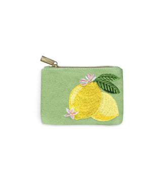 Small rectangular green canvas pouch with embroidered lemons, flowers, and leaves set right of center and a gold top zipper with pull tab