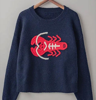 Navy blue sweater with bright red and cream embroidered lobster design and ribbed neckline and bottom hem