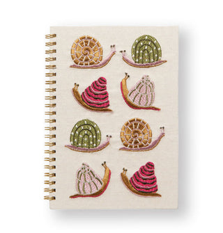 Cream-colored cloth journal notebook with 8 colorful embroidered snails and gold spiral binding