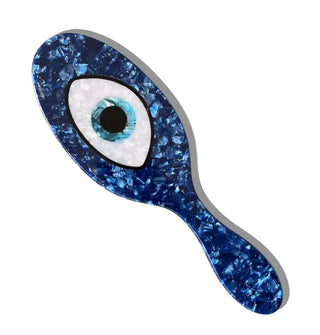 Hairbrush with a blue quartz finish and central evil eye paddle design