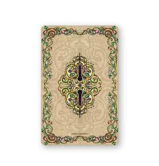 Card back from the Fairy Tale Lenormand deck features illustration of mirrored keyholes in an ornate border