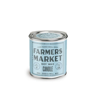 Candle tin resembling a paint can with blue label that says, "Farmers Market Soy Wax Candle"