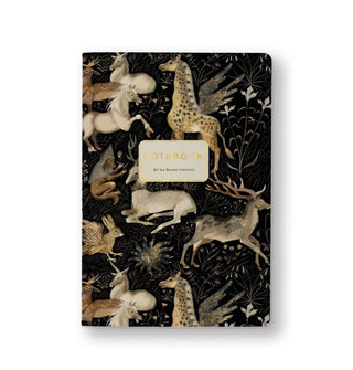 Black notebook cover with central gold foil title lettering features illustrations of various animals, some with wings, among delicate floral accents
