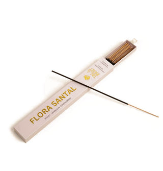 Light pink slide box of Flora Santal incense sticks with white ribbon pull and metallic gold lettering