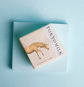Wrapped bar of TokyoMilk soap features illustration of a unicorn and the words, "Follow your dreams"