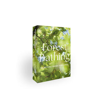 Forest Bathing card deck box features a photograph of sun filtering through green tree leaves against a blue sky