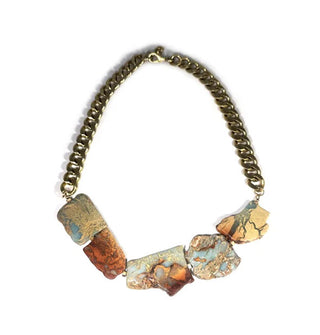 Five natural jasper stones are strung on thick gold-toned curb chain