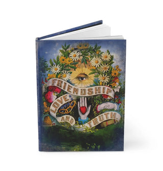 Open journal features cover illustration of an all-seeing eye surrounded by daisies and hovering above a banner that reads, "Friendship love and truth" accented by a chain, shaking hands, hand with heart in its palm, and other symbology