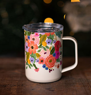 White mug with colorful floral design and a clear lid