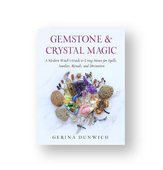 Light blue cover of Gemstone & Crystal Magic: A Modern Witch's Guide to Using Stones for Spells, Amulets, Rituals, and Divination by Gerina Dunwich features central photograph of a cluster of stones and herbs