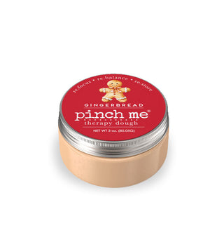 Peach and red 10-ounce pot of Gingerbread scent Pinch Me Therapy Dough with white lettering and a gingerbread man illustration on the lid