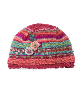 Pink, purple, and green striped beanie with a scalloped edge and textural flower and leaf details