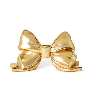 Sculptural gold bow taper candle holder