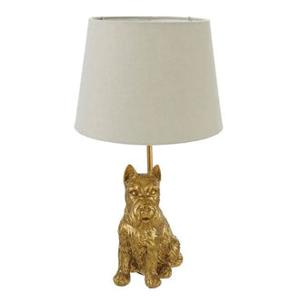 Table lamp with a gold Scottish terrier base and a white shade