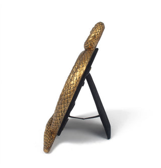 Side view of gold snake frame shows rear easel support with connected ribbon