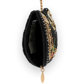 Beaded coin purse keychain is unzipped to show interior