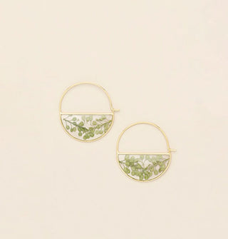 Gold hoop earrings with bottom semicircles containing resin-encased pressed green flowers, stems and leaves
