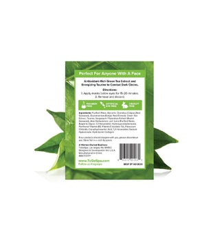 Reverse side of ToGoSpa Eyes Green Tea The Dark Circle Warrior Under Eye Masks packet flanked by green tea leaves