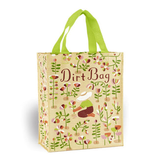 Beige tote bag with lime green handles features all-over flower illustrations with a central kneeling gardener picking one of them under the words, "Dirt Bag"