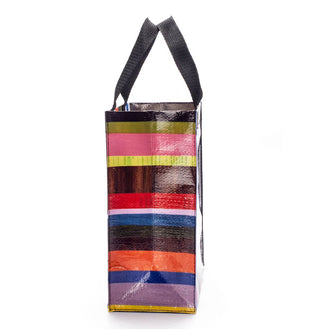 Side view of a tote bag with colorful horizontal stripes and black handles
