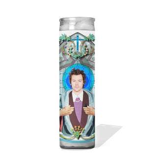 Tall glass prayer candle with colorful label depicting Harry Styles as a saint