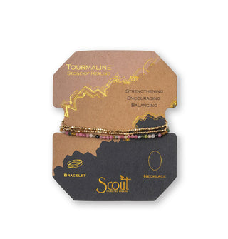 Tourmaline and gold beaded bracelet/necklace wrapped around product card with gold foil design details