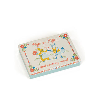 Flat rectangular box features illustration of a fox and bouquet-wielding rabbit exchanging sharing a cigarette and says, "High on Life...and possibly weed" 
