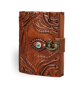 Brown leather book with rough-edged pages features textural cover details and stitching, a central blue eye, and strap closure with brass lock
