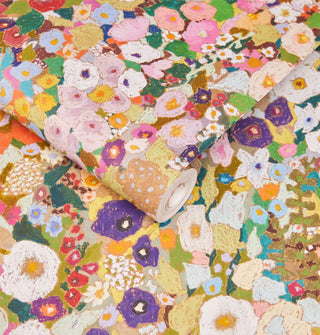 Roll and sample of colorful floral print wallpaper in an Impressionist style