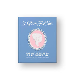 Blue cover of I Burn for You: The Little Guide to Bridgerton with central pink and white cameo illustration and white title lettering
