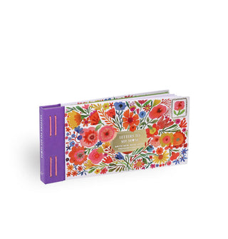 Cover of Letters to My Mom features elaborate, colorful floral illustrations, a central metallic gold title block, and purple spine with orange stitching