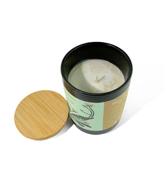 Candle jar shown from above with wooden lid removed to reveal a single wick inside