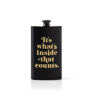 Black flask with gold lettering that says, "It's what's inside that counts."