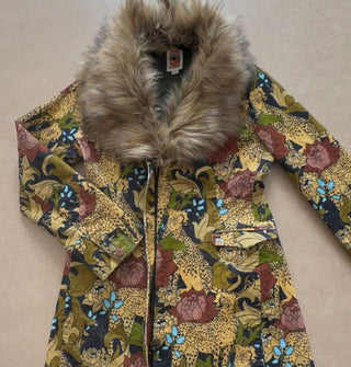 Zip-front jacket with faux collar features a dense print of cheetahs and flowers