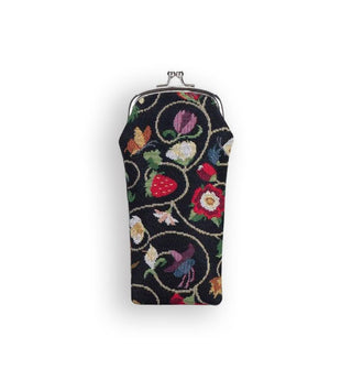 Fabric eyeglass pouch with gold kisslock frame and hardware features print of floral and strawberry vines on a black background