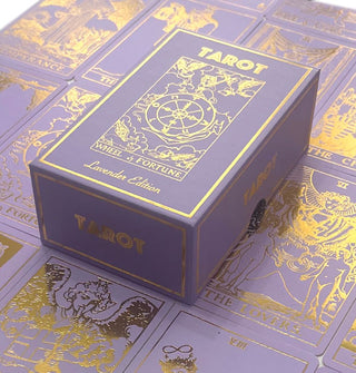 Lavender Edition tarot box sits atop sample cards from the deck
