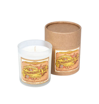 Frosted glass jar Lemongrass & Tea candle with decorative label next to brown tube gift packaging with matching label